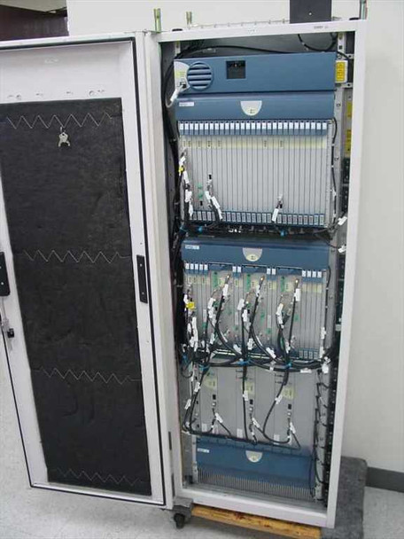 Open telecommunications equipment cabinet containing radio and network modules